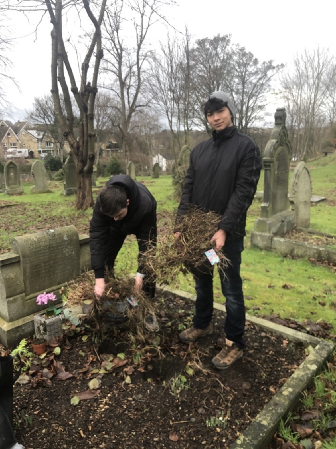 BEG-Jan Young volunteers tidying up graves