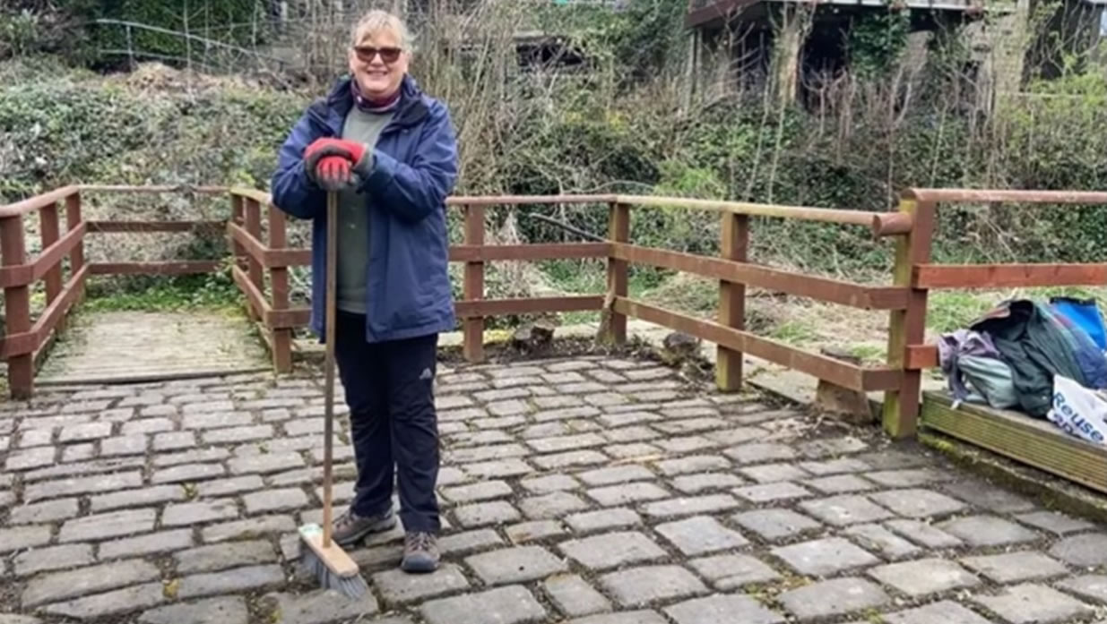 BEG-apr4 Smiling volunteer standing on newly cleaned cobbles