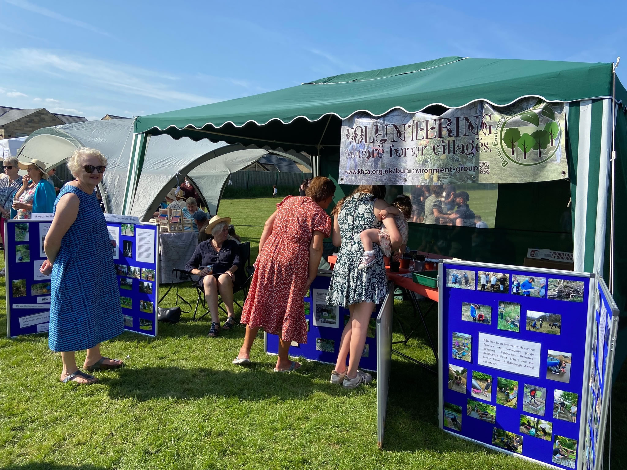 Gazebo with information about BEG at a beer festival on a sunny day