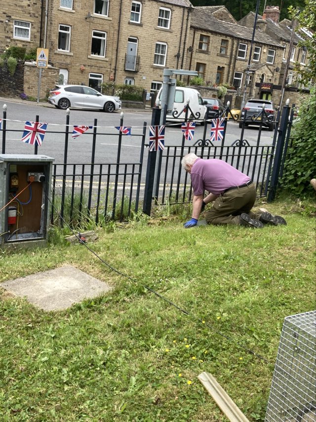 The Memorial Gardens being tidied up by volunteers - trimming all the shrubs, cutting grass and deadheading plants.