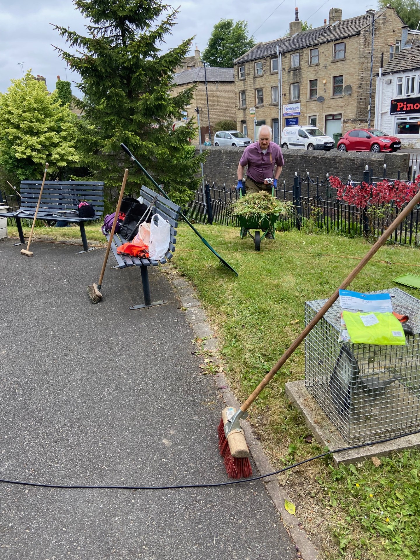 The Memorial Gardens being tidied up by volunteers - trimming all the shrubs, cutting grass and deadheading plants.