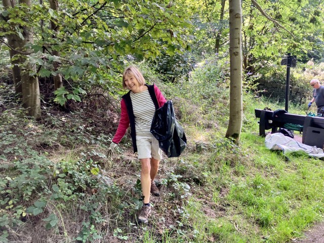 Happy volunteer litter picking