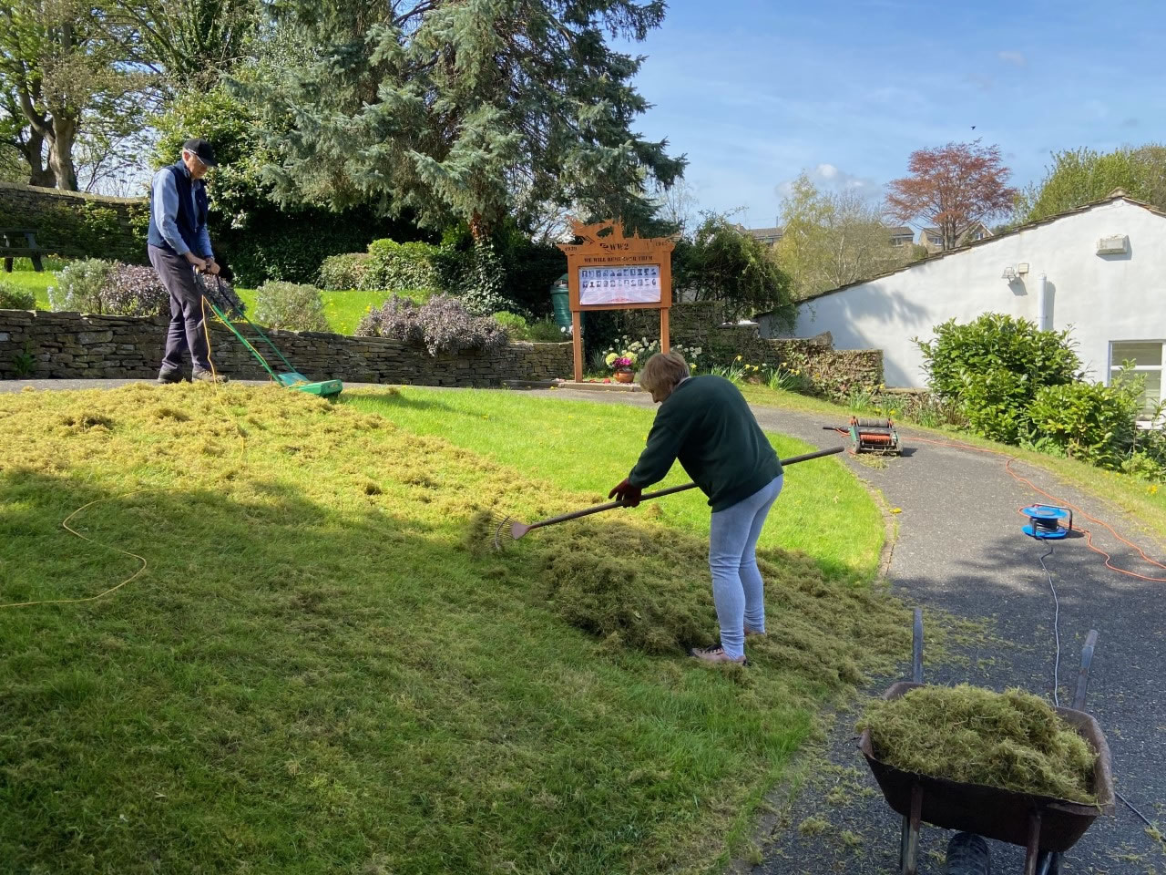 Scarifying to remove the moss and dead grass embedded in the all the grassed areas.